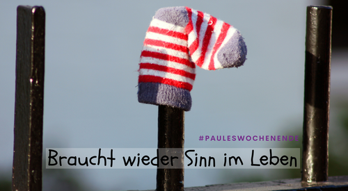 eine Socke auf einem Zaun steckend
