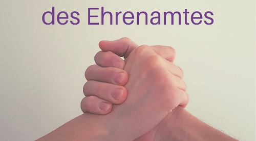 Zwei Hände die ineinandergreifen und der Aufschrift "Tag des Ehrenamtes"